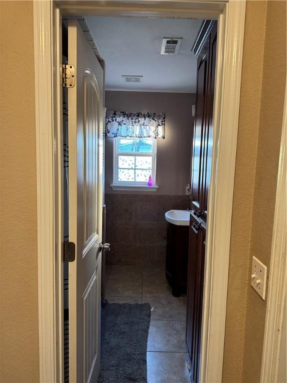 bathroom with vanity and tile patterned floors