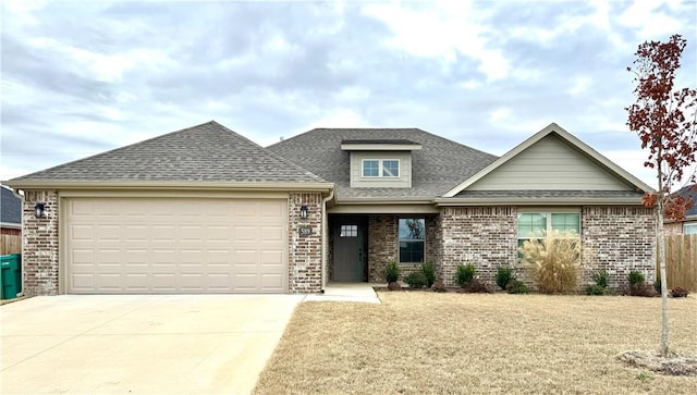 view of front facade with a garage and a front yard