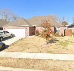 ranch-style home with a garage