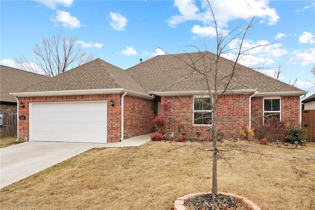 single story home featuring a garage and a front yard