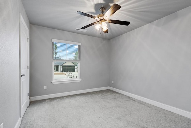 carpeted empty room with ceiling fan