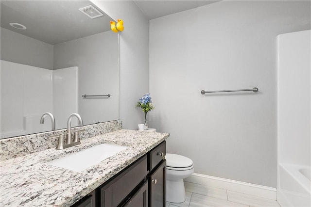 bathroom featuring vanity and toilet