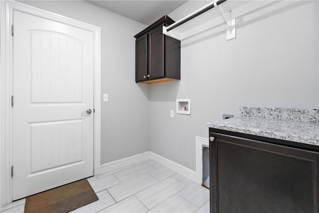 clothes washing area with cabinets, hookup for a washing machine, and electric dryer hookup