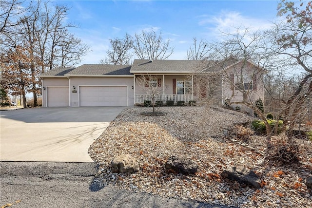 ranch-style home featuring a garage and a porch