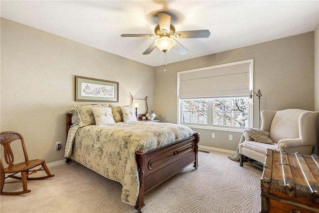 bedroom with ceiling fan and light carpet