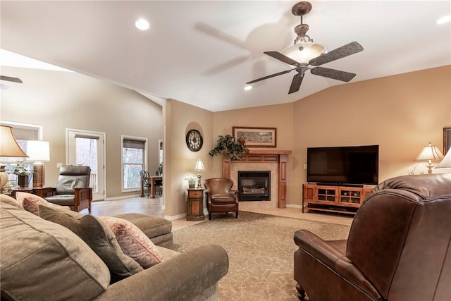 living room featuring ceiling fan and vaulted ceiling