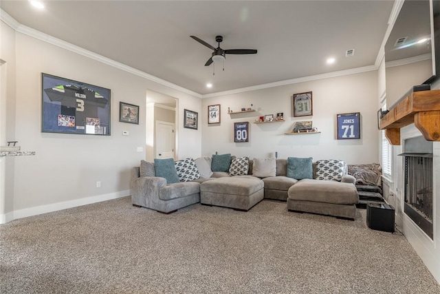 carpeted living room featuring ceiling fan and crown molding