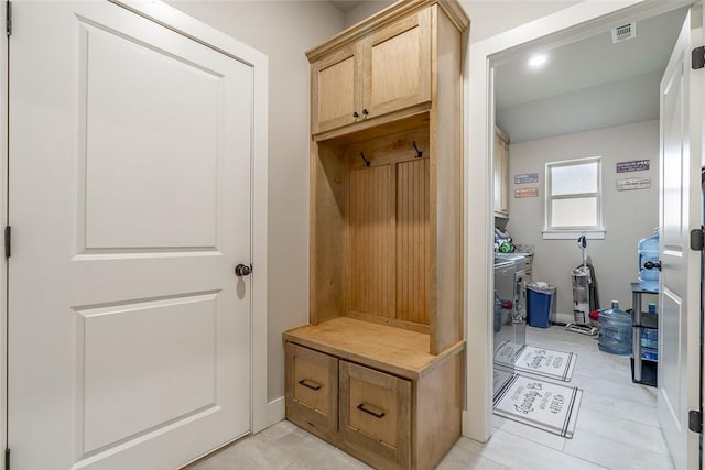 mudroom with light tile patterned floors