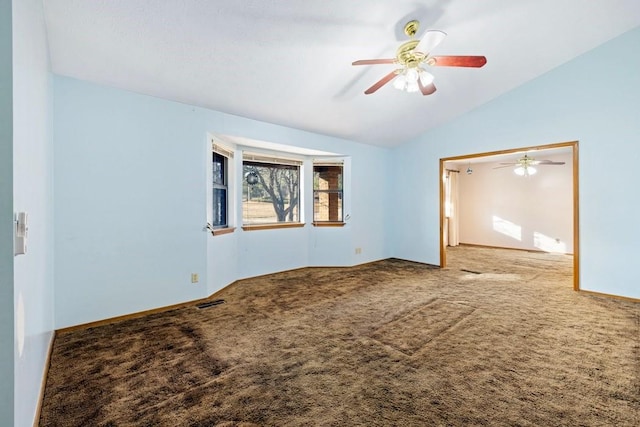 spare room with carpet, ceiling fan, and lofted ceiling