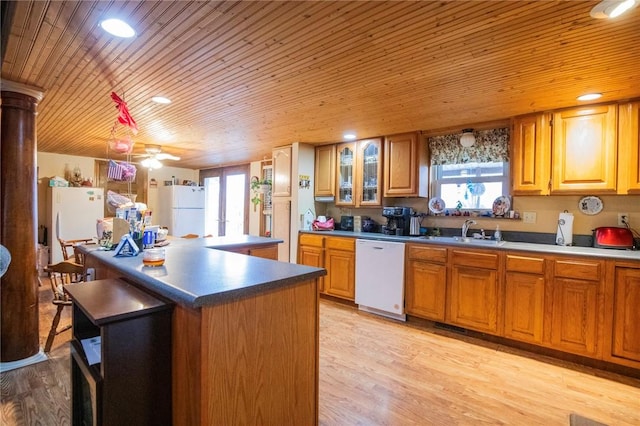 kitchen with french doors, white appliances, sink, and light wood-type flooring