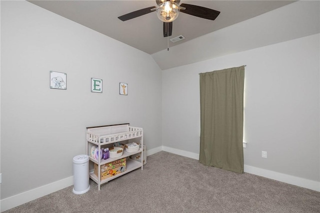 carpeted bedroom featuring ceiling fan and vaulted ceiling