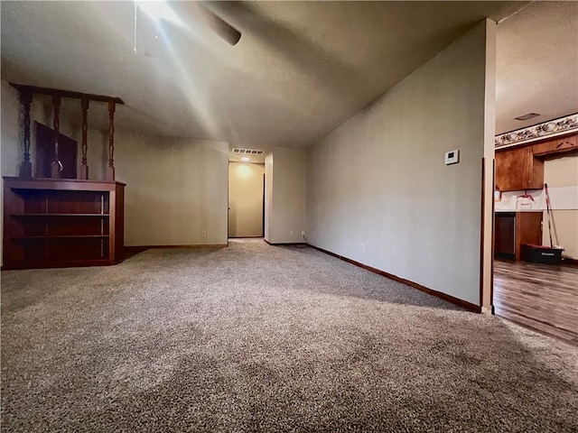 additional living space featuring carpet flooring and ceiling fan