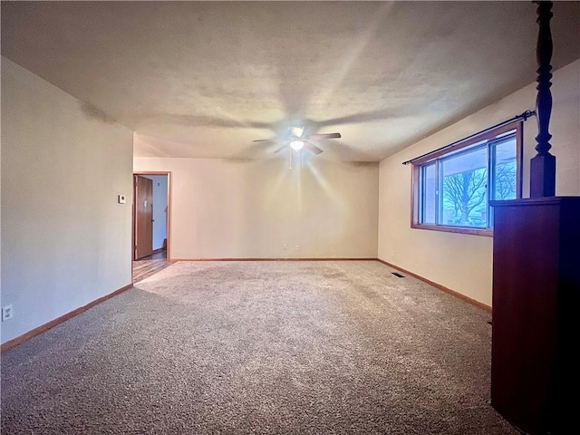 carpeted empty room with ceiling fan