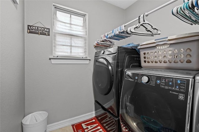 clothes washing area featuring washer and dryer