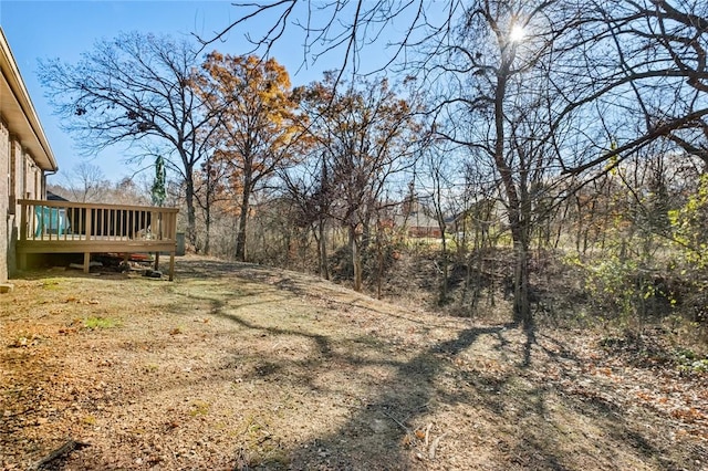 view of yard with a wooden deck