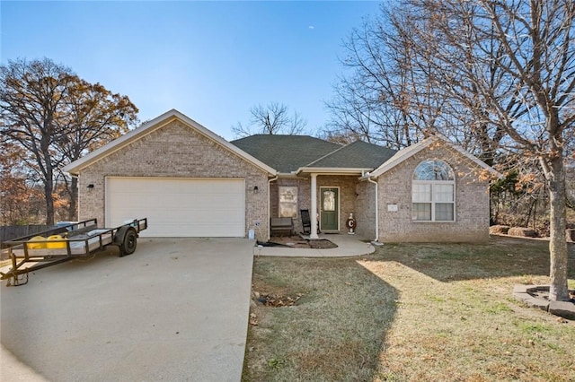 ranch-style home with a garage and a front lawn