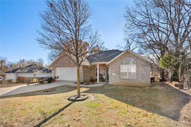 view of front of home with a front yard and a garage