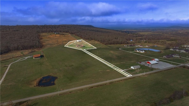 birds eye view of property featuring a rural view