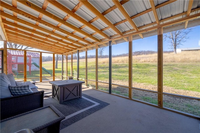 sunroom / solarium featuring a rural view