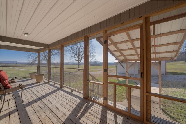 unfurnished sunroom featuring a rural view