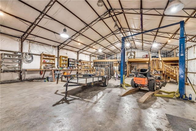 miscellaneous room featuring concrete floors and a workshop area