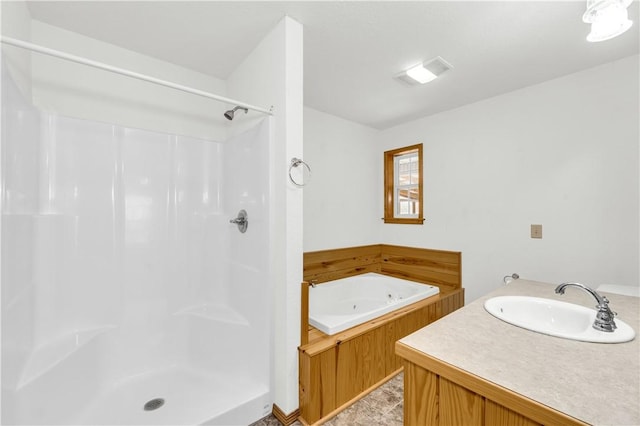 bathroom featuring separate shower and tub and vanity