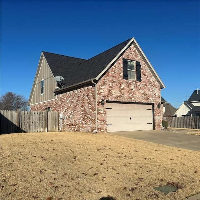 view of side of property featuring a garage