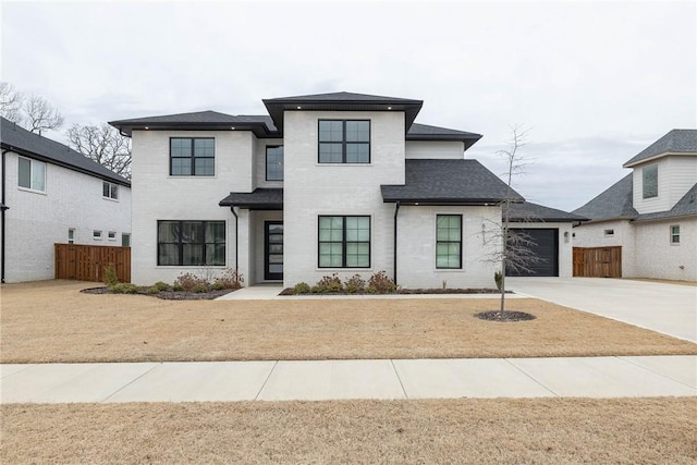 view of front of house featuring a front lawn and a garage