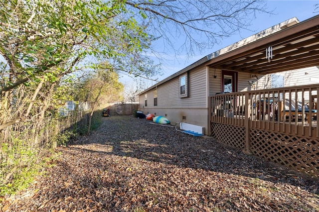 view of property exterior featuring a deck