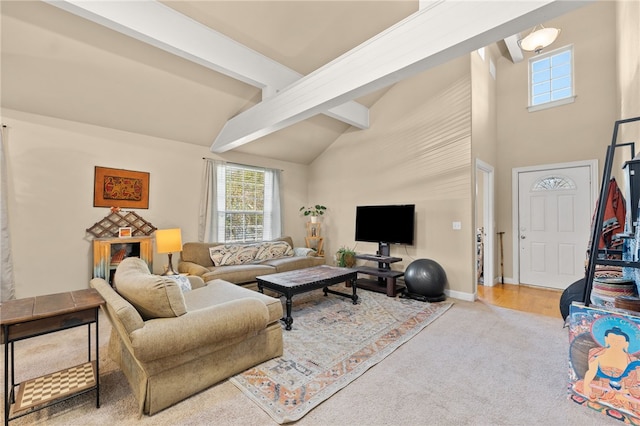 living room featuring beamed ceiling and a high ceiling