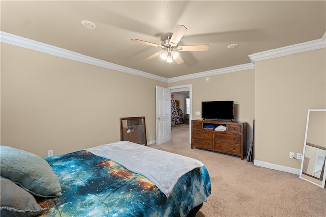 carpeted bedroom with ceiling fan and ornamental molding