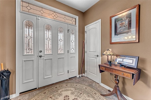 foyer entrance with baseboards