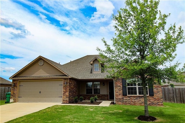 view of front facade with a garage and a front yard