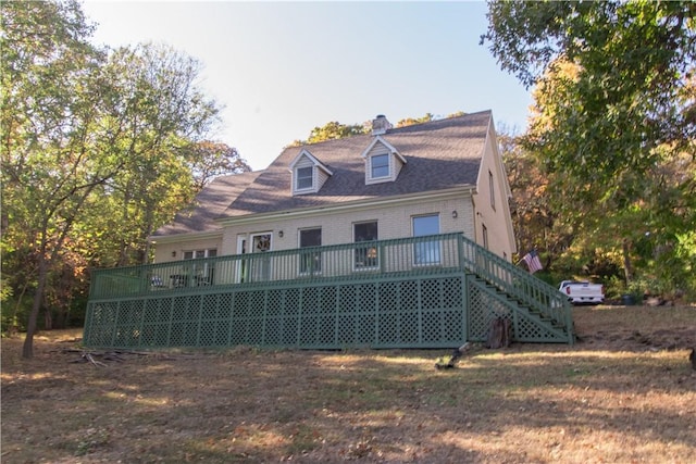 back of property featuring a wooden deck