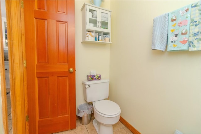 bathroom featuring tile patterned flooring and toilet