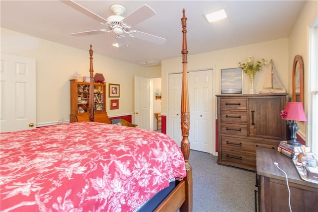 bedroom featuring ceiling fan, a closet, and dark colored carpet