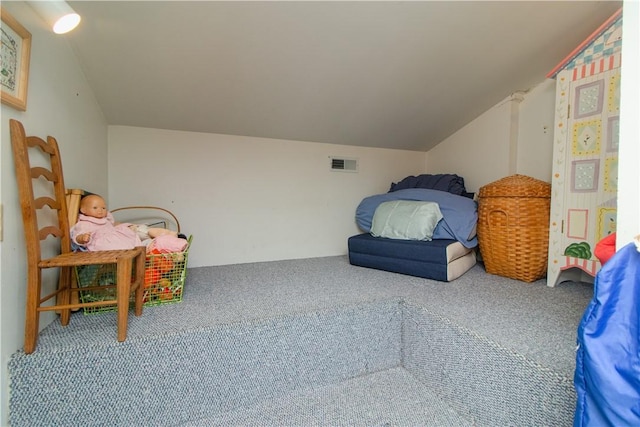 interior space with carpet floors and vaulted ceiling