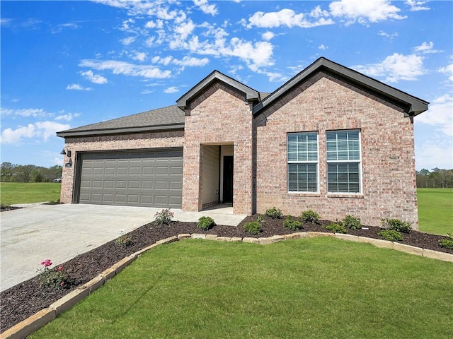 view of front of property with a front lawn and a garage