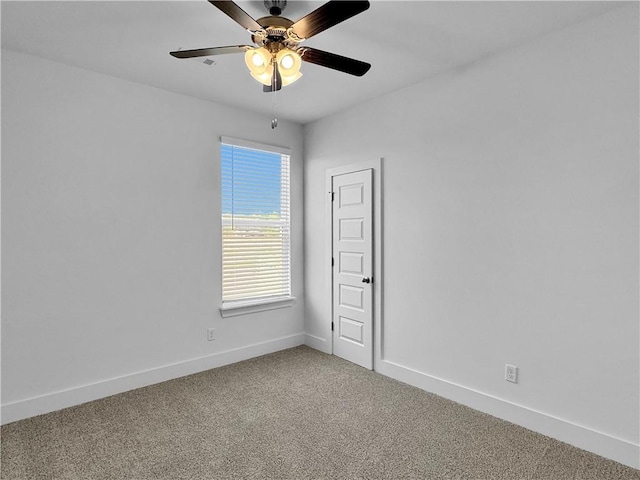 empty room with carpet and ceiling fan