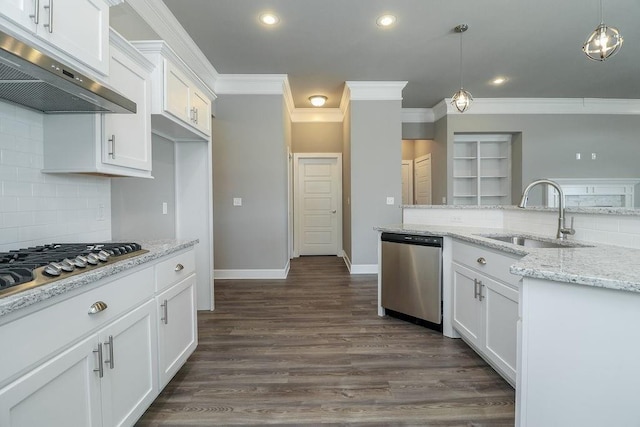 kitchen with white cabinets, decorative light fixtures, stainless steel appliances, and sink