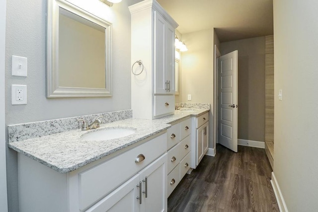 bathroom featuring vanity and hardwood / wood-style flooring