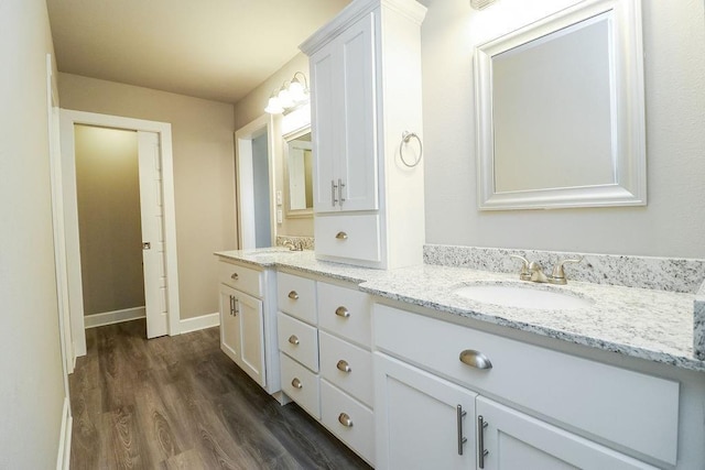 bathroom featuring vanity and hardwood / wood-style flooring