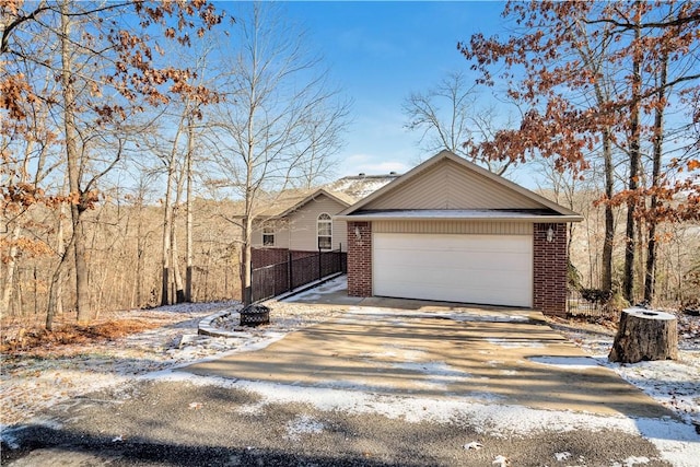 view of front of home with a garage and an outdoor structure