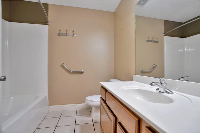 bathroom with tile patterned floors, toilet, vanity, shower / bathtub combination, and baseboards