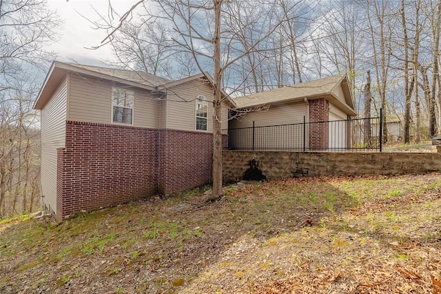 back of house with brick siding