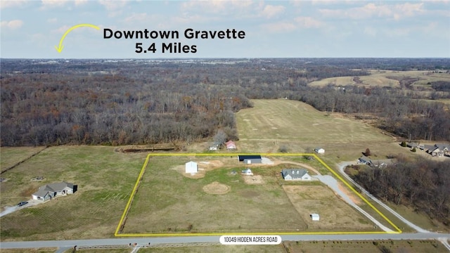 birds eye view of property featuring a rural view