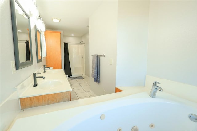 bathroom with tile patterned flooring, vanity, and separate shower and tub