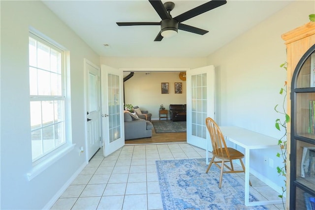 tiled home office with french doors and ceiling fan