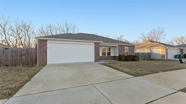 ranch-style home featuring a front yard and a garage