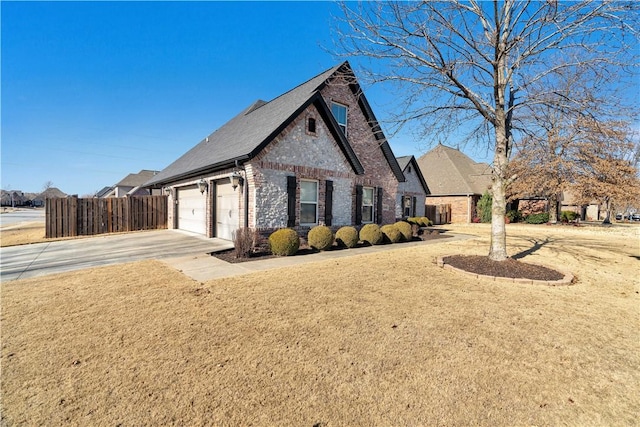 view of front of house featuring a front yard and a garage